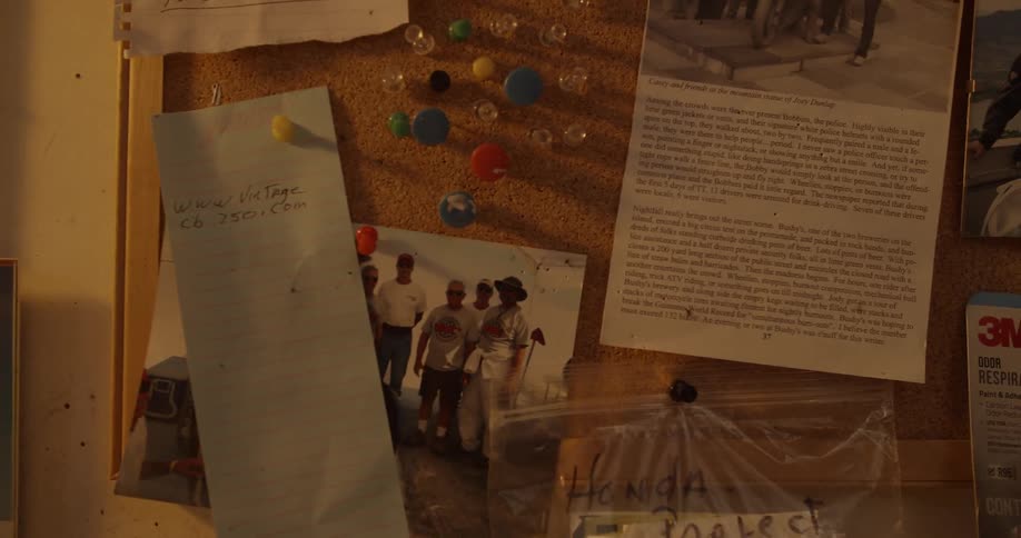 The wall has many photographs and posters