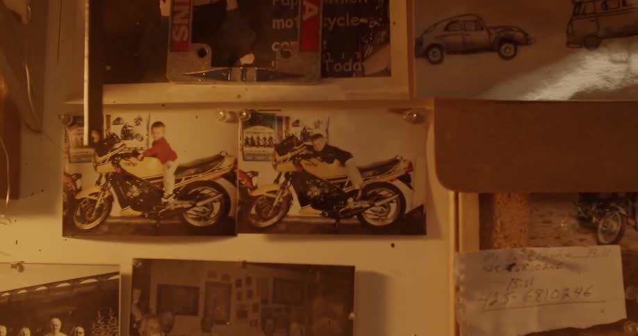 Pictures of motorcycles are on the wall