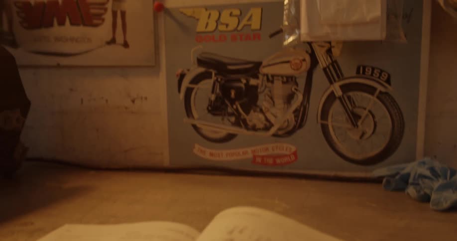 Man Working On Motorcycle In Garage