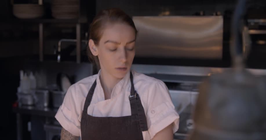 A chef is talking and working