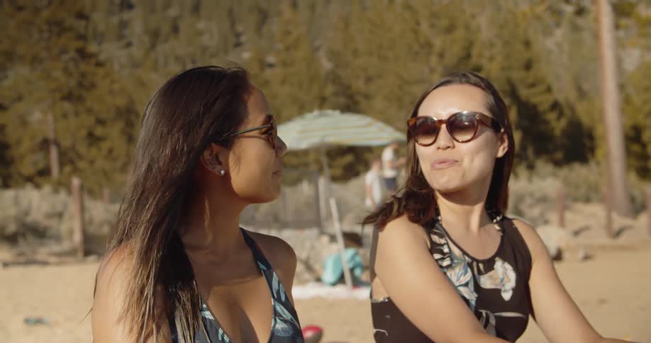 Friends are talking and enjoying the beach