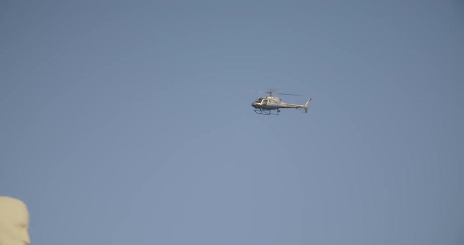 LAPD helicopter flies by Griffith Observatory