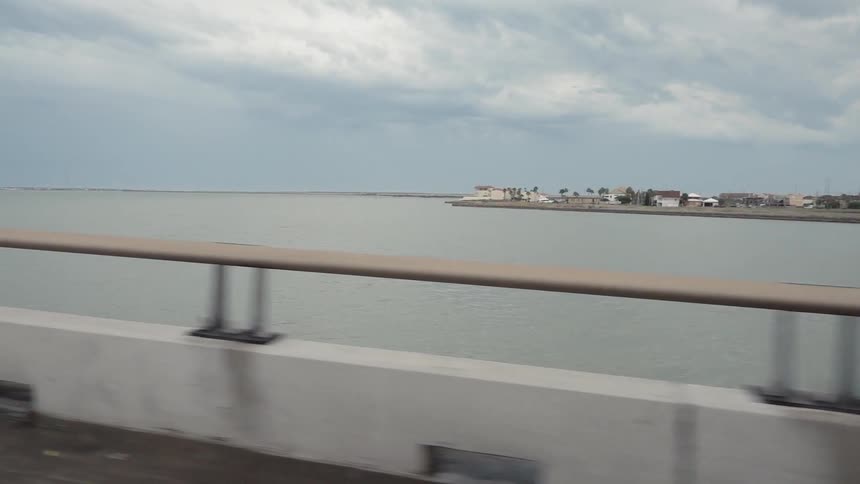The bridge reaches over the water