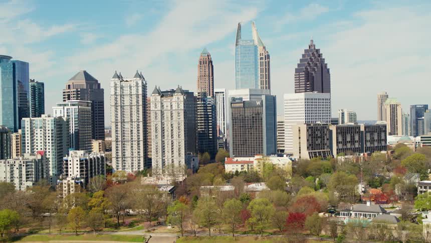 The buildings are brightly lit in the city on a sunny day