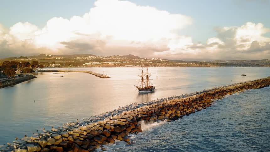 An old ship travels on the water