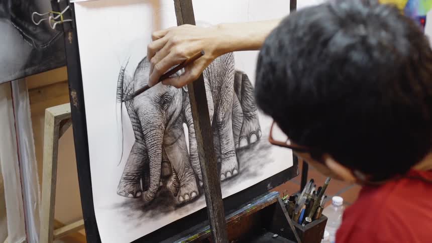 Man draws a picture of an elephant