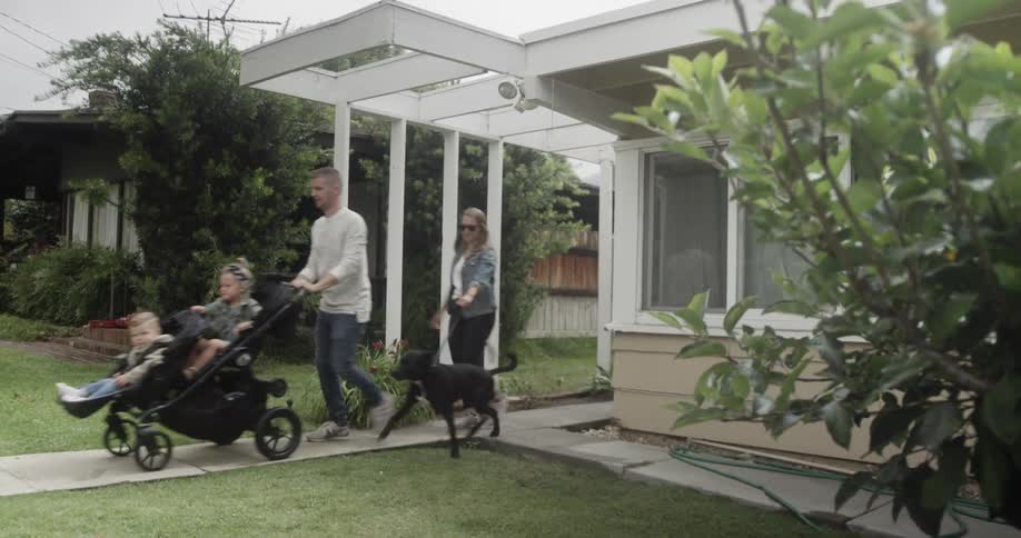 Family going on a walk with their kids and dog