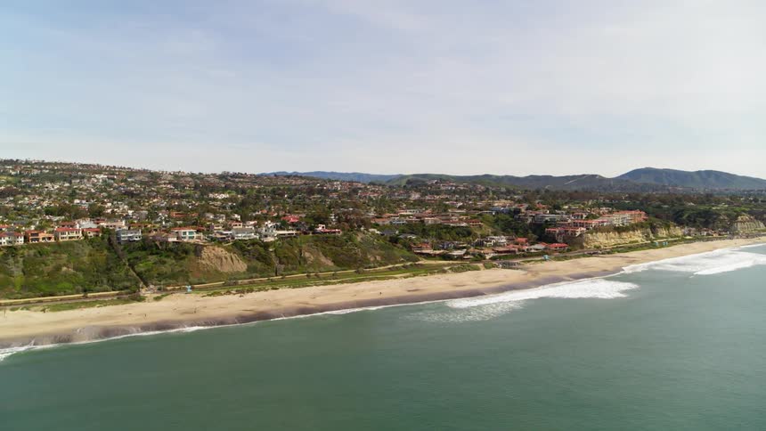 The tide flows onto the beach shore