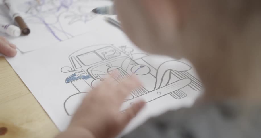 Children are coloring on the table