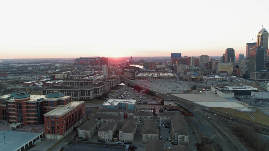 The city has many buildings and cars traveling