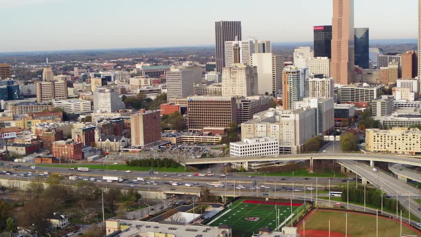 The highway is busy by the buildings