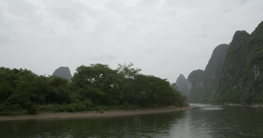 The waters flow in the stream on a hazy day