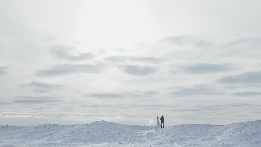 A person stands alone in a snowy expanse