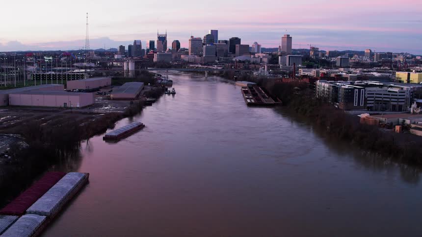 Water flows in the river surrounded by the city