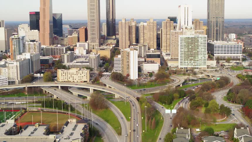 The cars drive around the winding roads in the city
