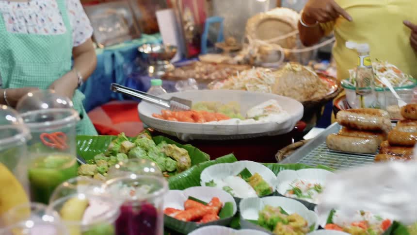 A woman serves food at a table