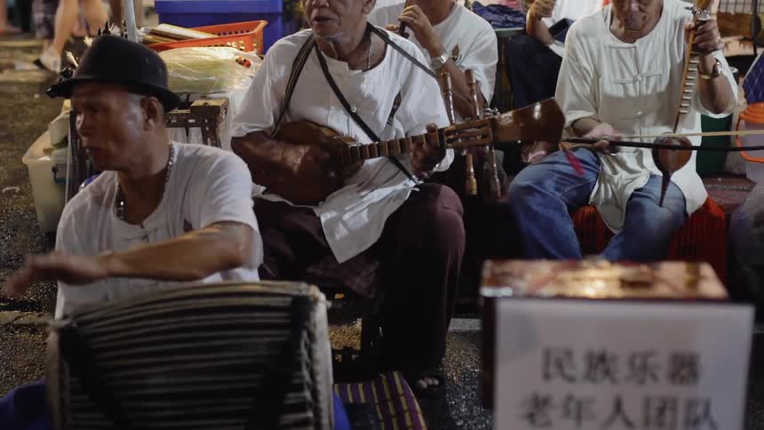 A band plays on a city sidewalk