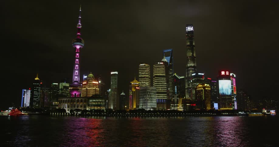 City buildings illuminate the night sky