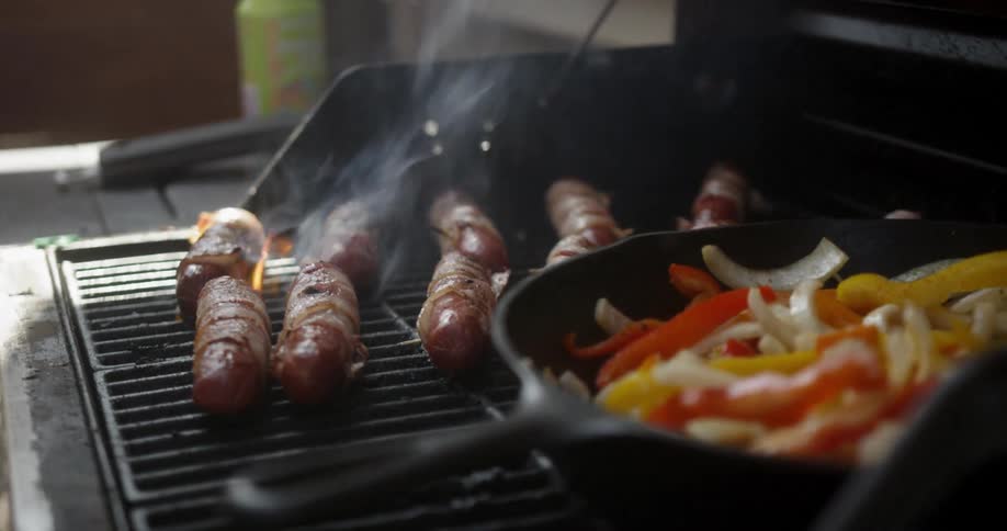 Food is being flipped on the barbecue