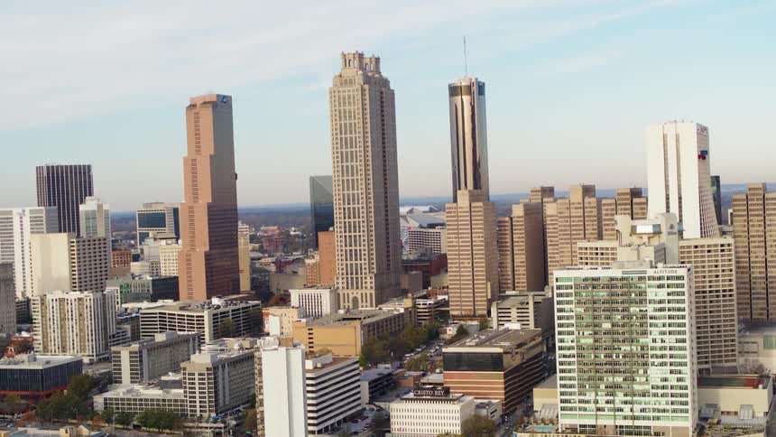 Tall buildings and skyscrapers in city on cloudy day