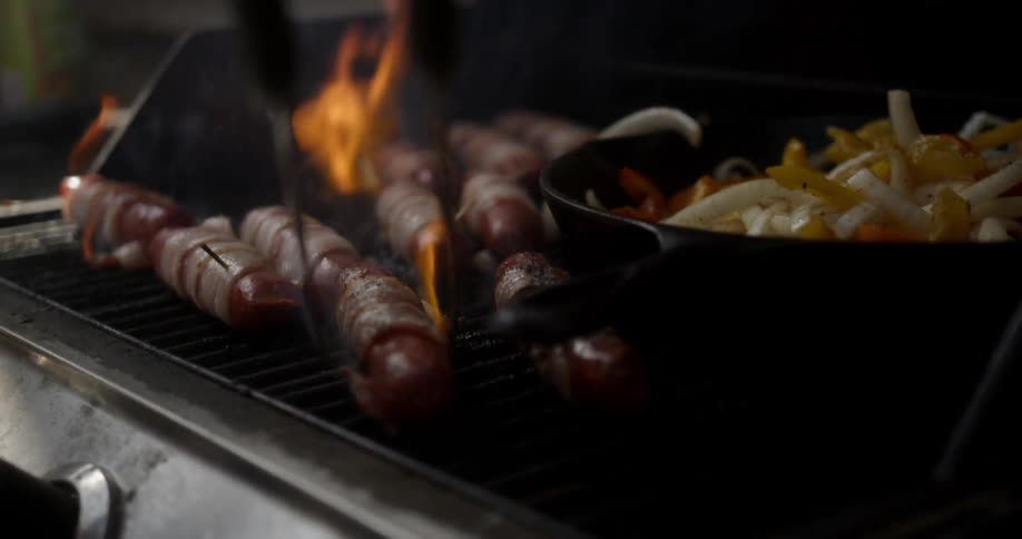 Meat and vegetables are cooked on a grill