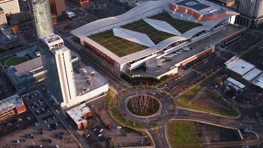 An athletic stadium sits in a large city