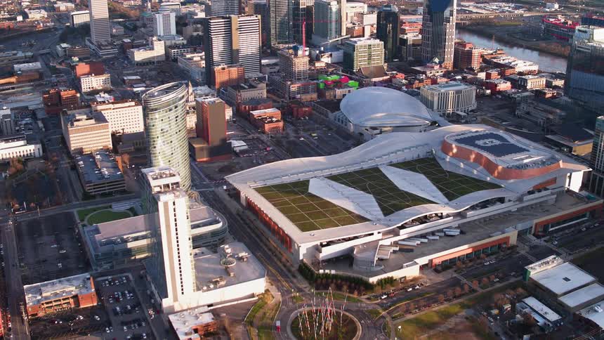 An athletic stadium sits in a large city