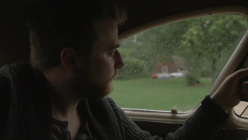 A person sitting in a car