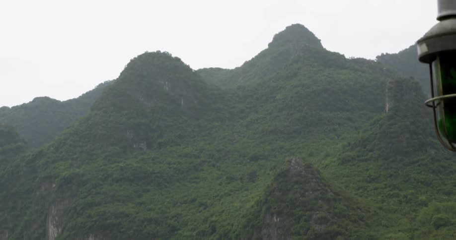 A boat floats on a mountain river