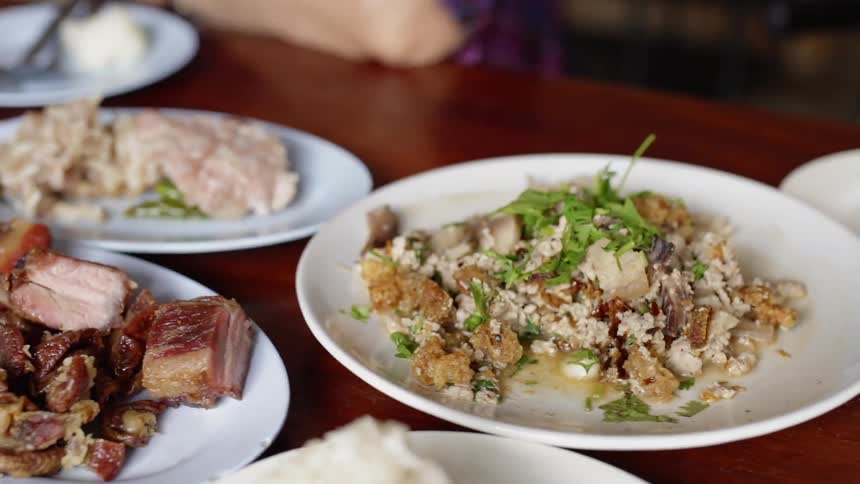 The table is full of different food dishes