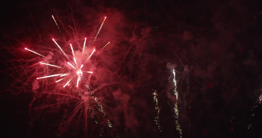 Beautiful red fireworks light up the sky
