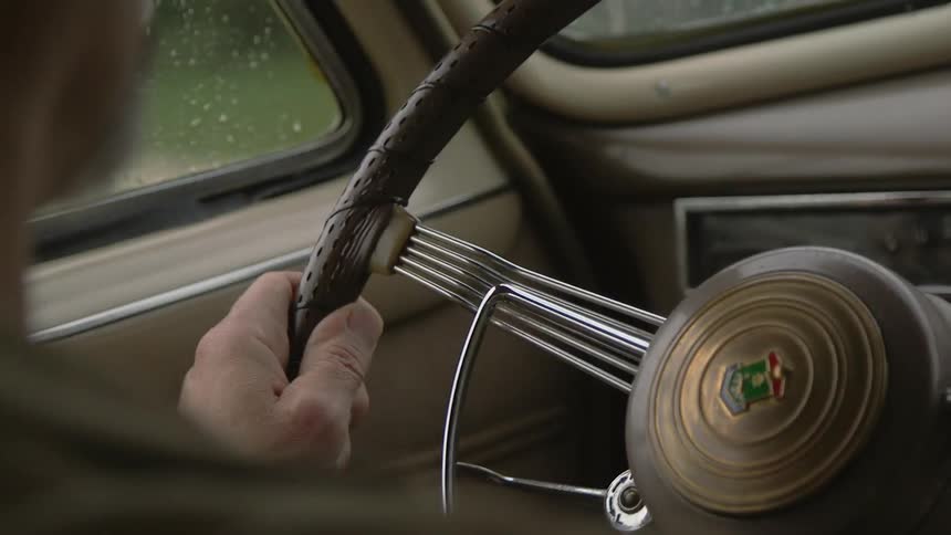 A person driving a car