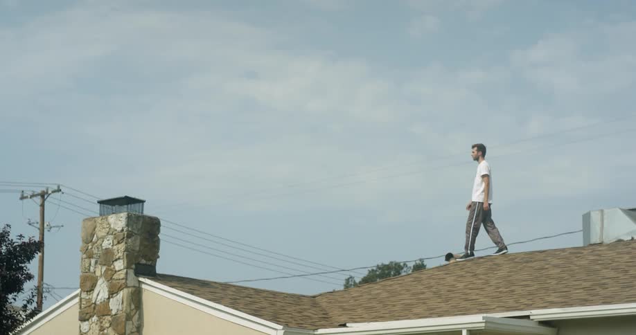 A man is walking on the roof