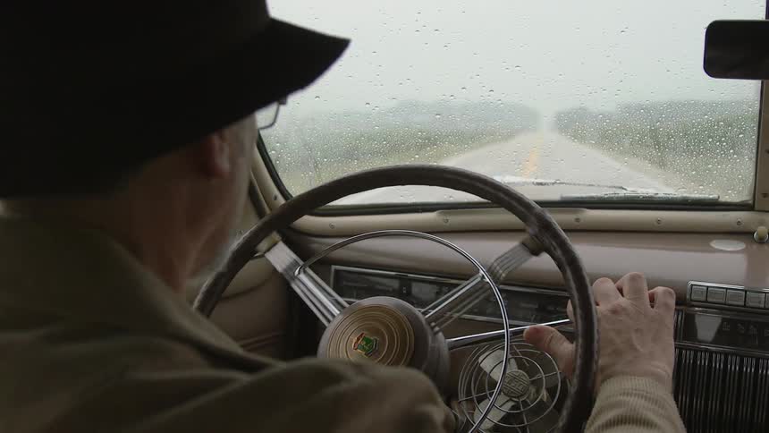 A man is driving his car