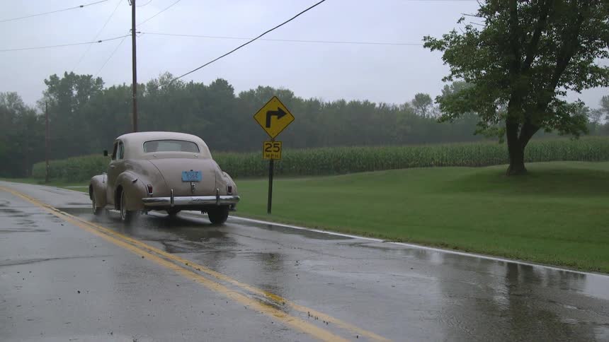 A car driving in the rain