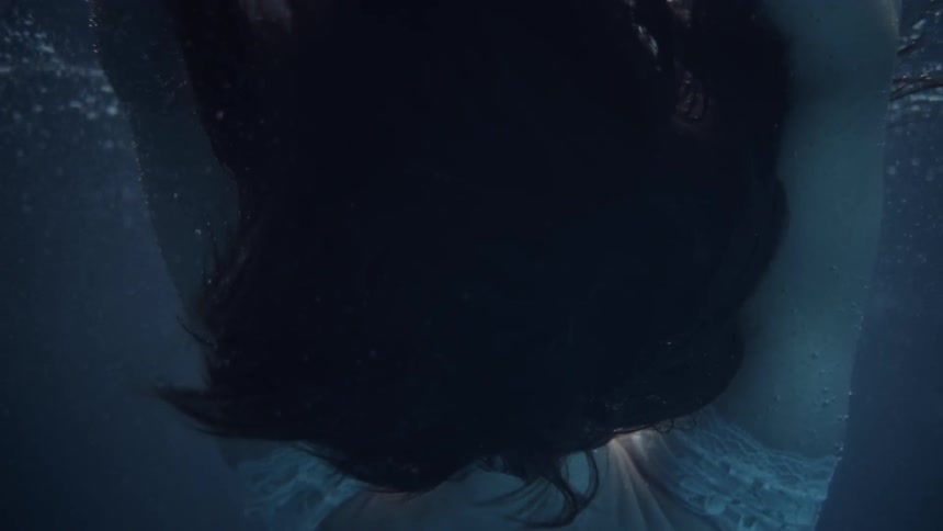A woman dives into the water