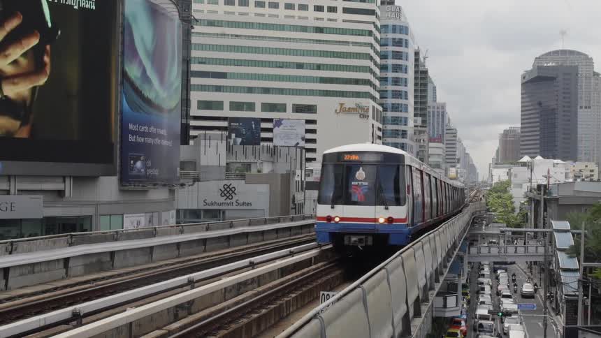 A passenger train travels through a city