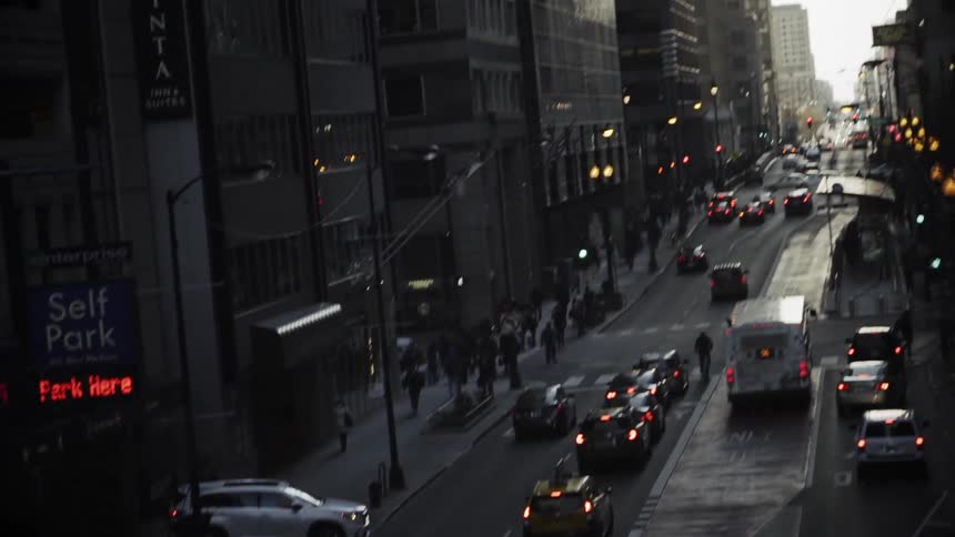 A commuter bus  pulls up into traffic