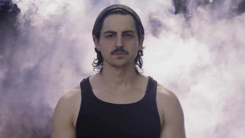 Man Standing in Smoky Wind