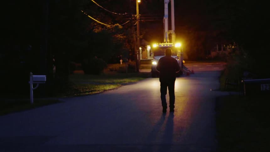 An electrical repair truck flashes its lights