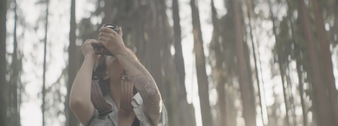 A woman takes photographs outside