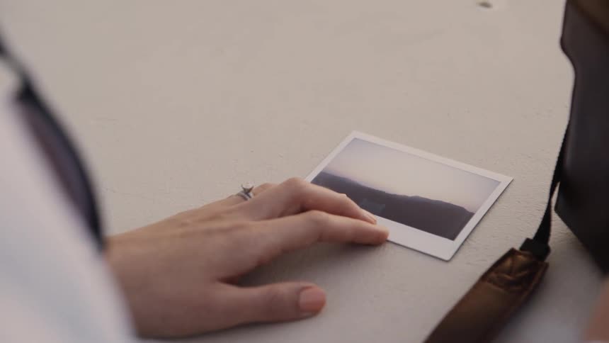 Woman's Hand on a Polaroid Photo