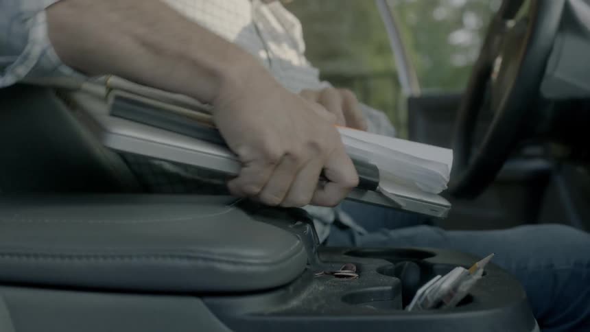 A man gets out of his vehicle