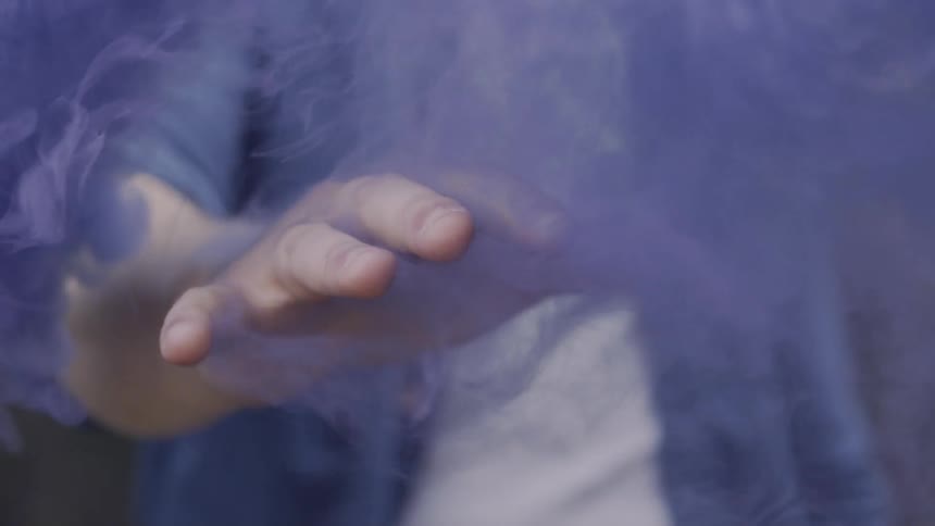 Purple Smoke Tendrils Wrap Around Fingers