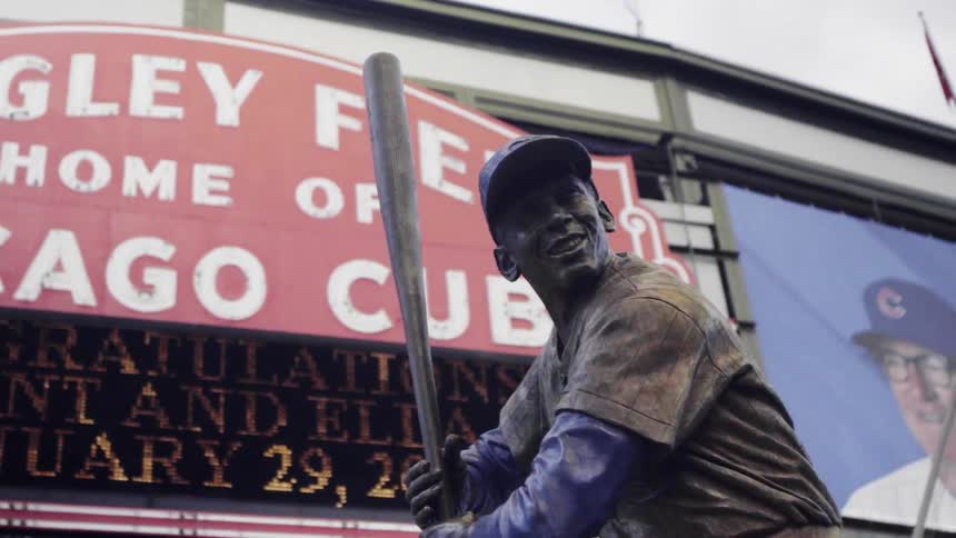 A statue of a baseball player stands at wrigley field
