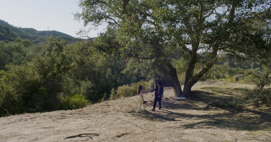 Two women walk together in the wilderness