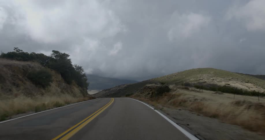 First person view of a winding country road