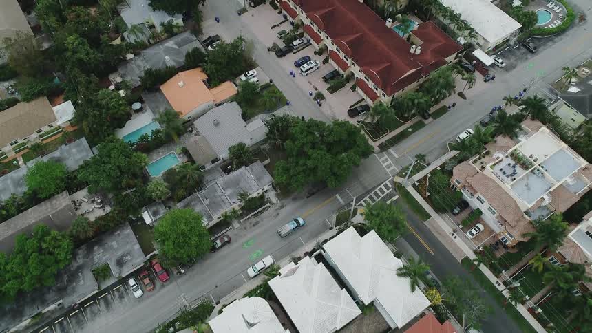 A truck drives on a city street