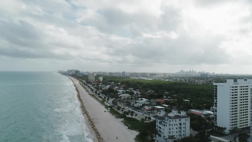 Large city on ocean coast on cloudy day