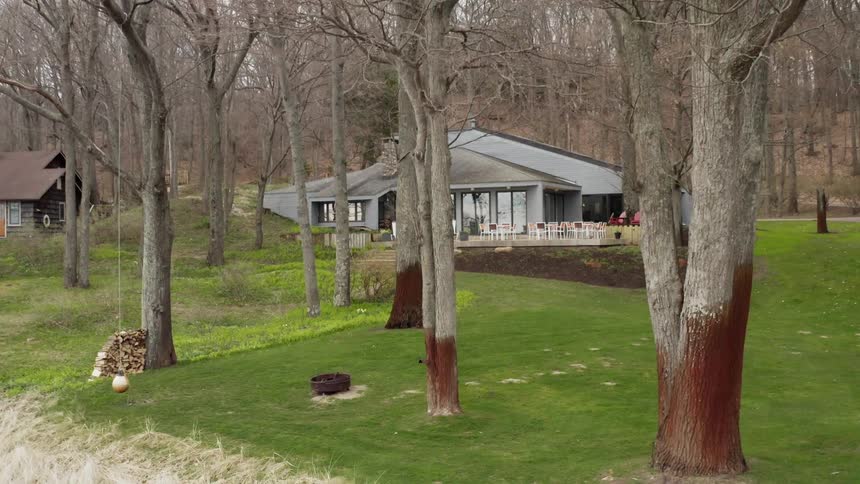 The green grass leads to the house